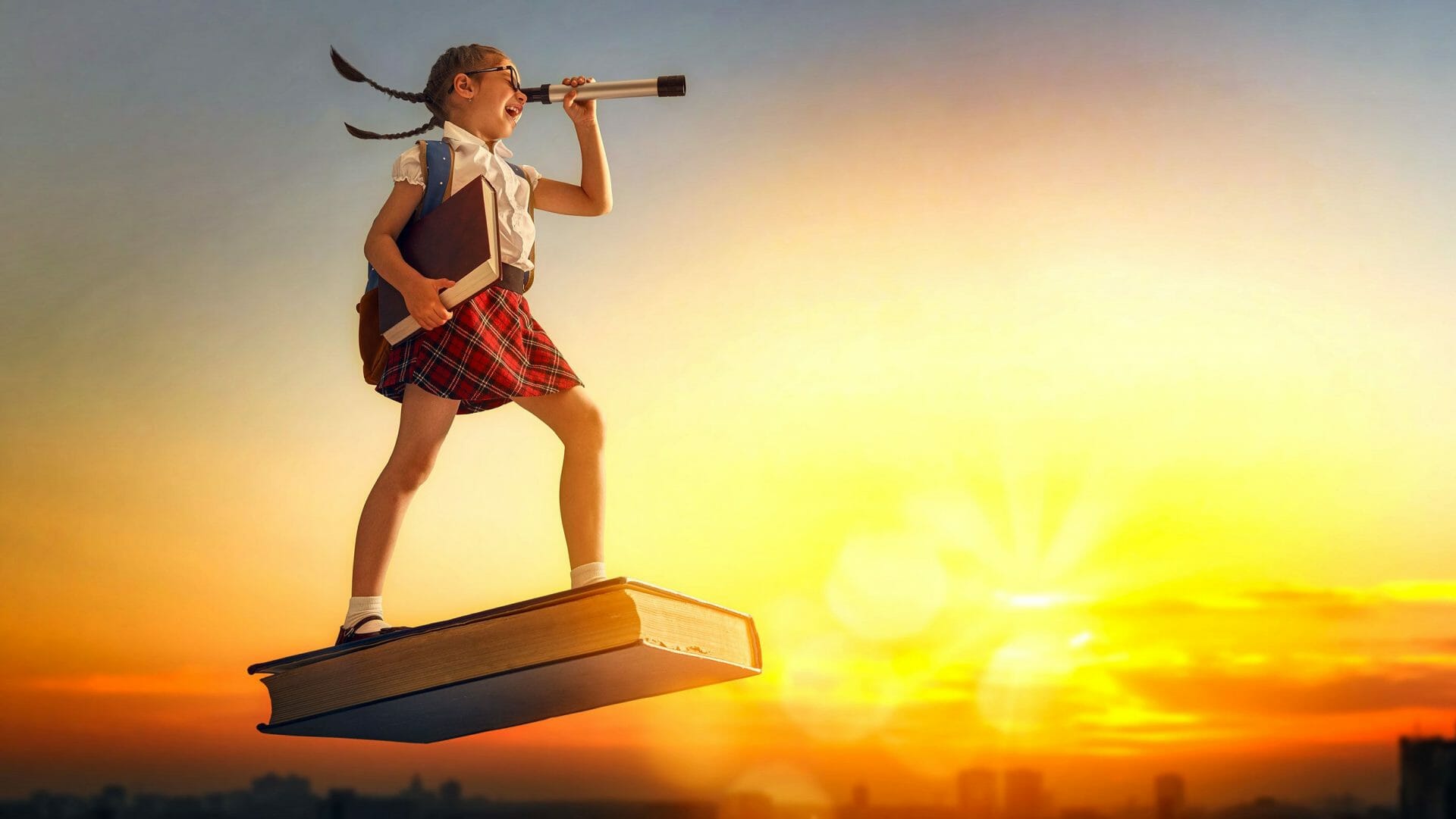 Cluey Learning book week girl flying on a book